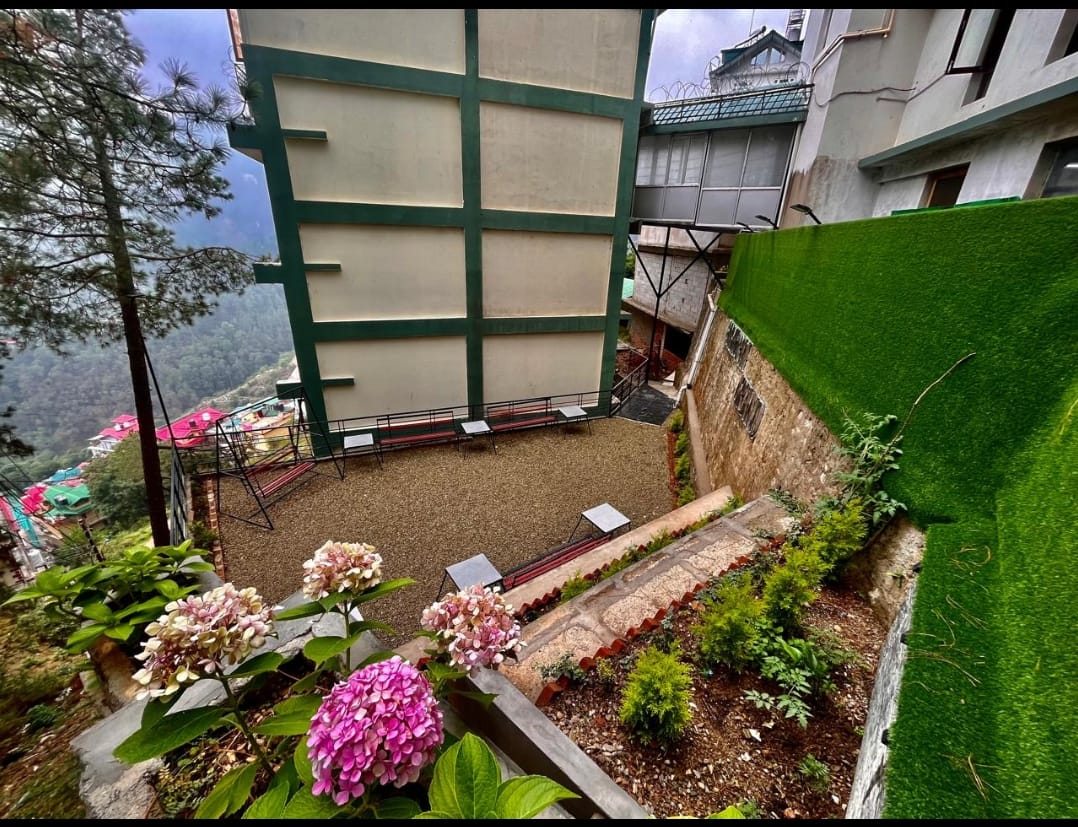 Landscaped garden and hill views